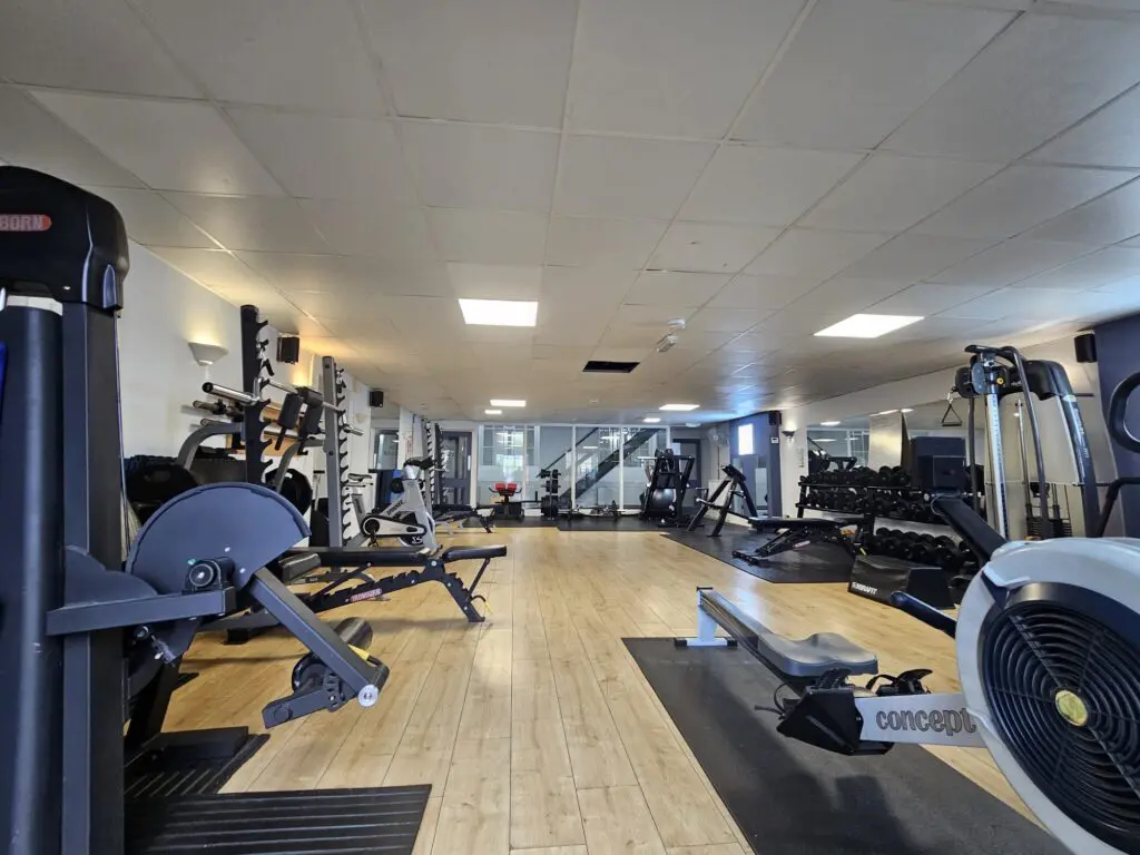 a gym room with a variety of exercise equipment at gibson studios
